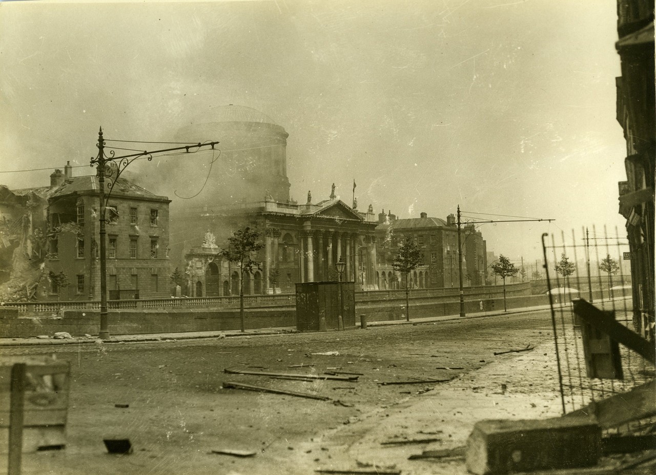 View of the façade of the Four Courts from Merchants' Quay by W.D. Hogan. Façade shows extensive damage to the west wing from shelling